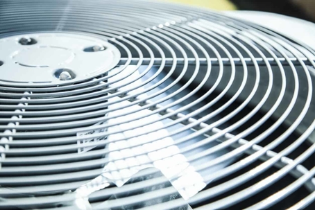 Top view of an air conditioner unit outdoors in hot summer season.